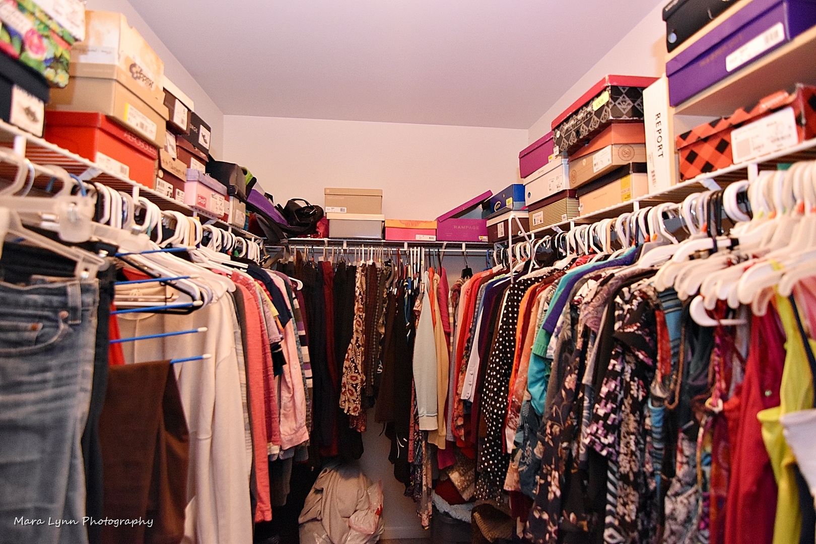 47 Rolling Oaks Road, Unit B Sugar Grove, IL 60554 - Photo 17 of 22 a view of walk in closet with clothes and shoes