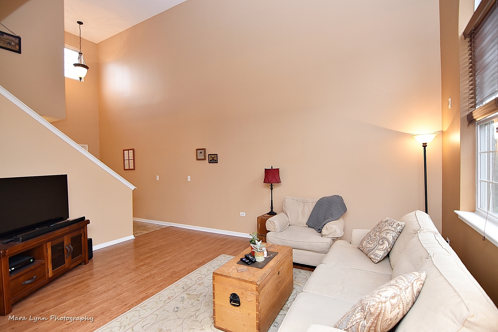 47 Rolling Oaks Road, Unit B Sugar Grove, IL 60554 - Photo 4 of 22 a bedroom with furniture and a flat screen tv