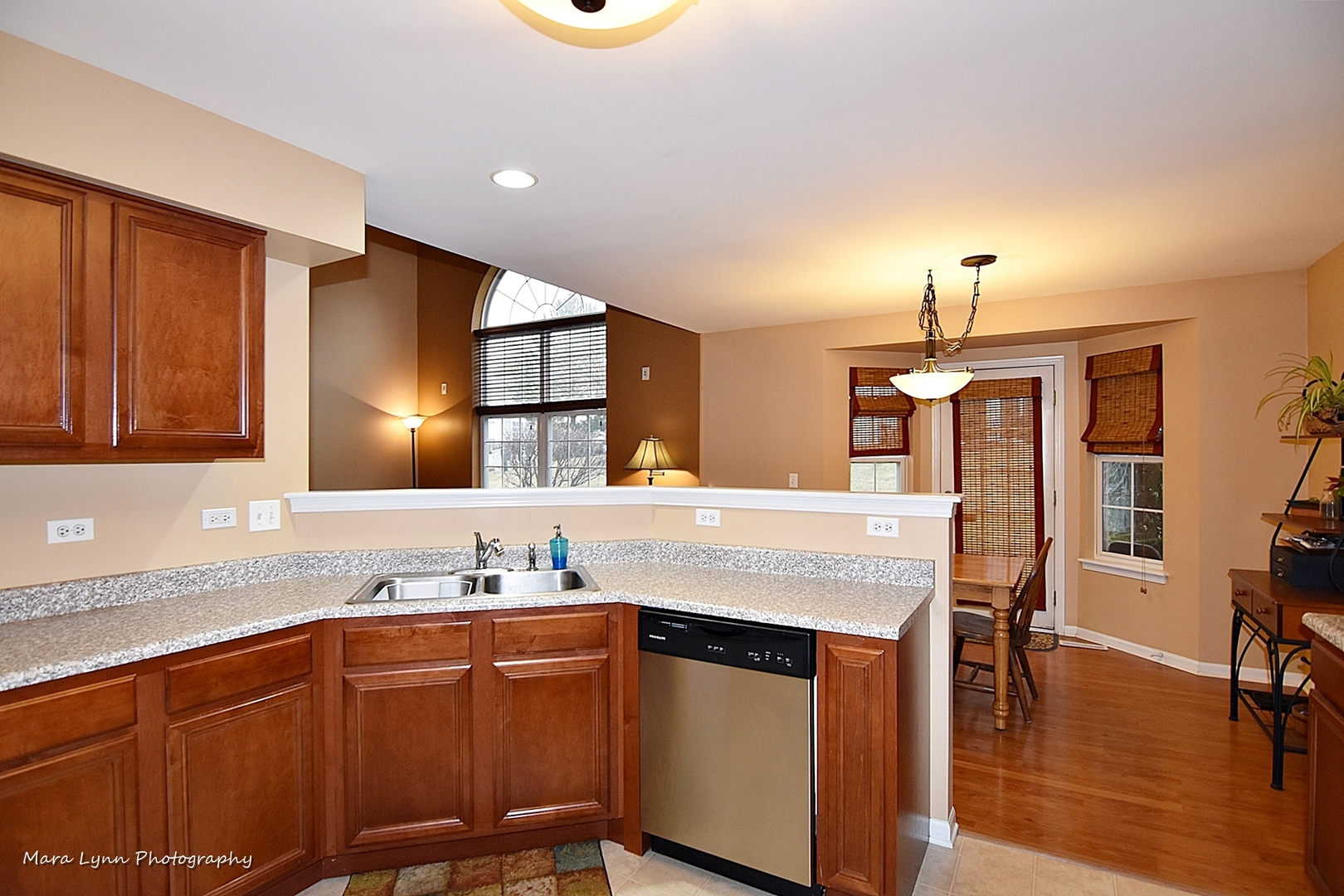 47 Rolling Oaks Road, Unit B Sugar Grove, IL 60554 - Photo 9 of 22 a kitchen with stainless steel appliances granite countertop a sink refrigerator and cabinets