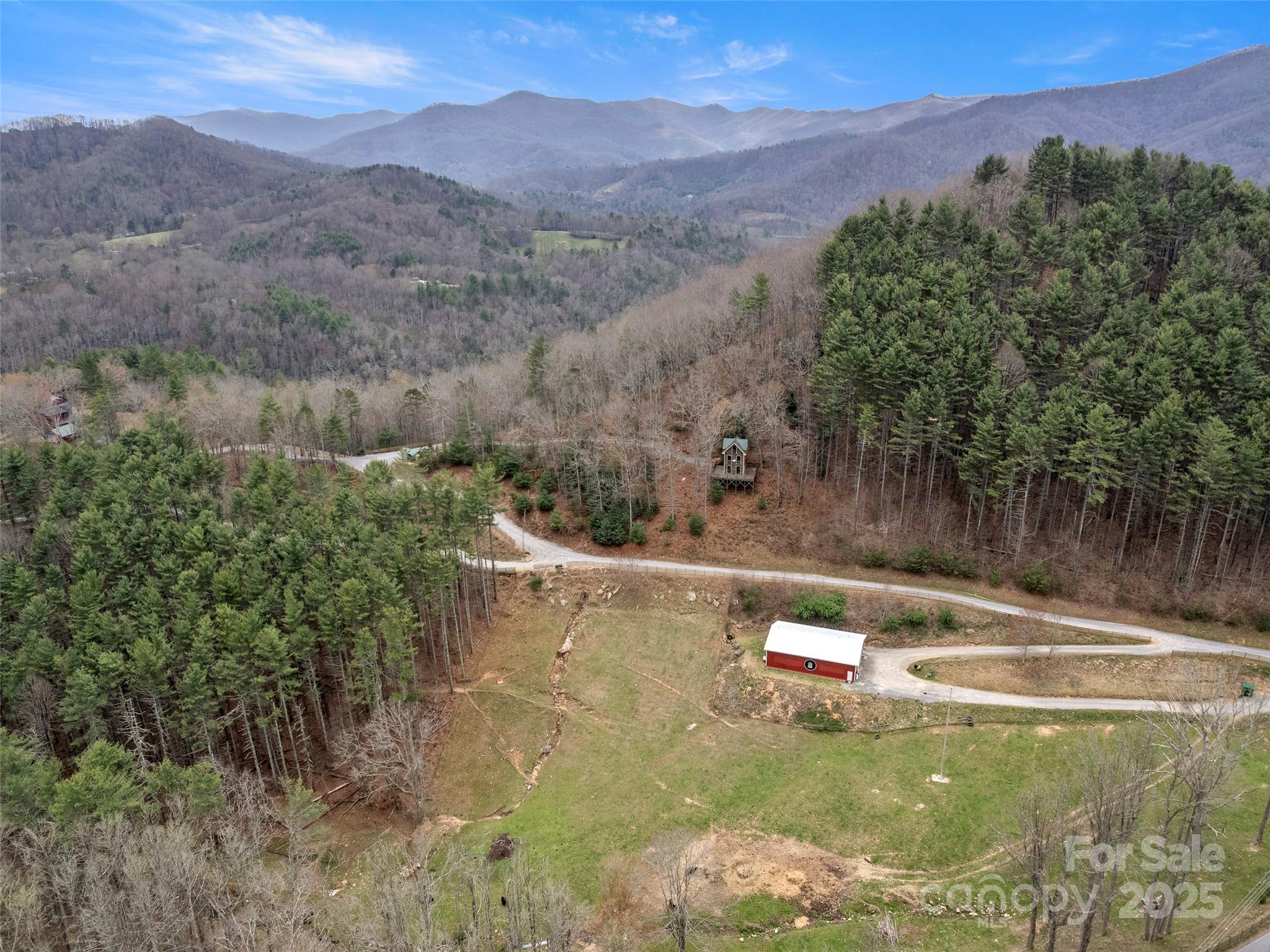 9999 Panther Creek Road, Unit B Clyde, NC 28721 - Photo 1 of 7 a view of a pool with a yard