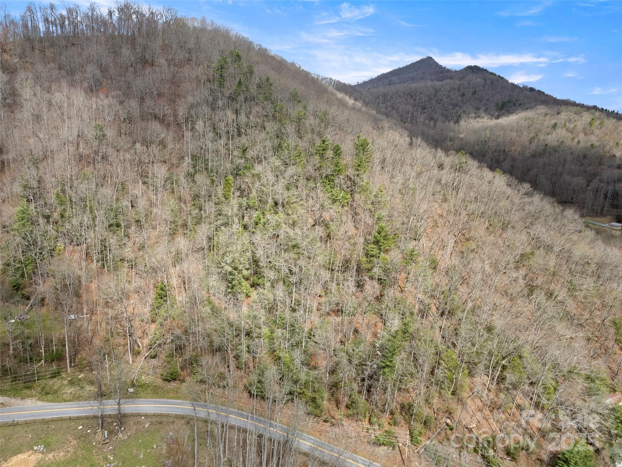 9999 Panther Creek Road, Unit B Clyde, NC 28721 - Photo 6 of 7 a view of a lake with mountains in the background