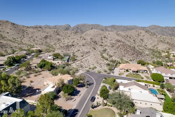 a view of a road with a mountain in the background