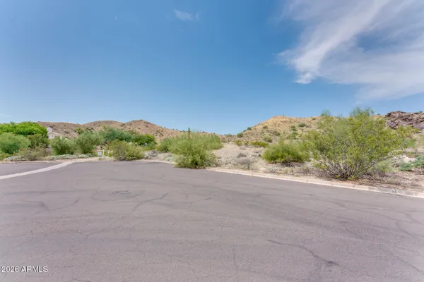 a view of a road with a yard