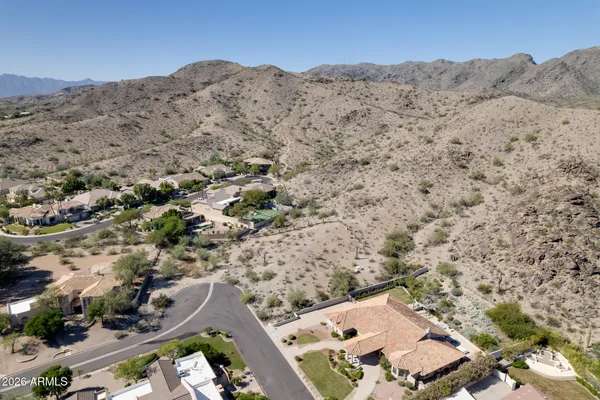 an aerial view of house with yard