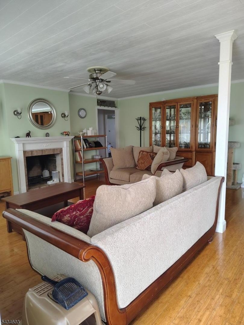 442 River Road North Arlington, NJ 07031 - Photo 5 of 26 a living room with furniture and a fireplace
