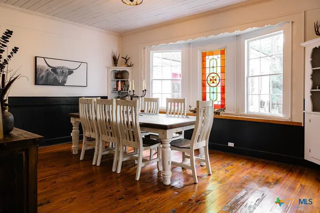 a dining room with furniture window wooden floor
