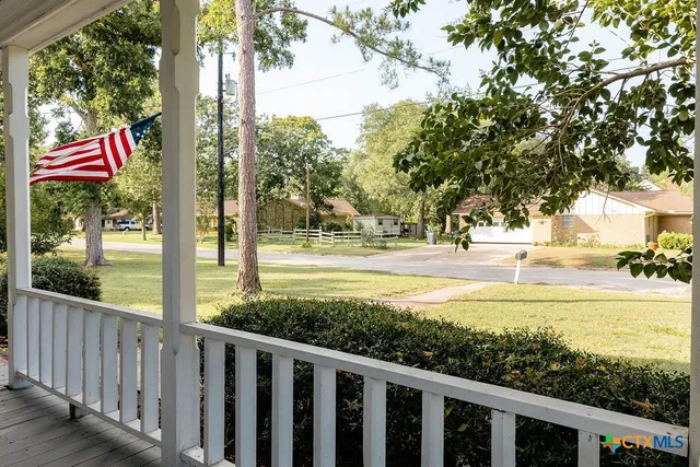 a view of a street with an outdoor space