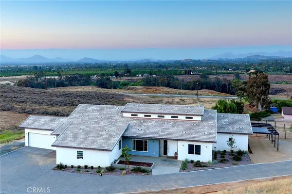 an aerial view of a house with a garden