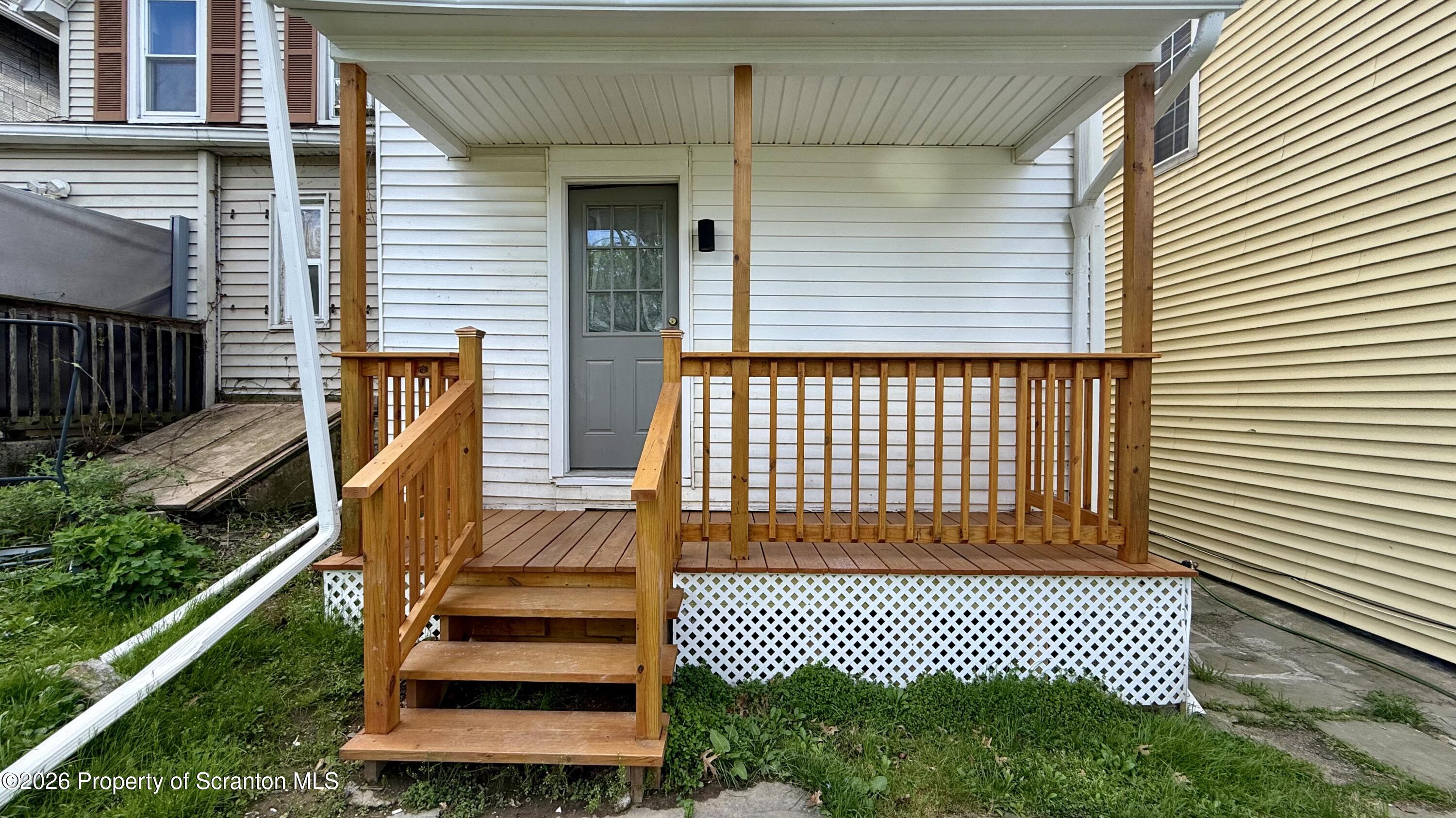 1032 Chestnut Street Sunbury, PA 17801 - Photo 20 of 25 a view of a brick house with wooden fence