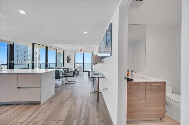 a view of a living room and entry way