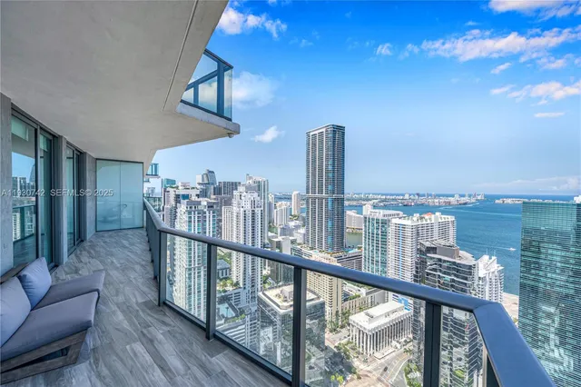 a view of a balcony with furniture