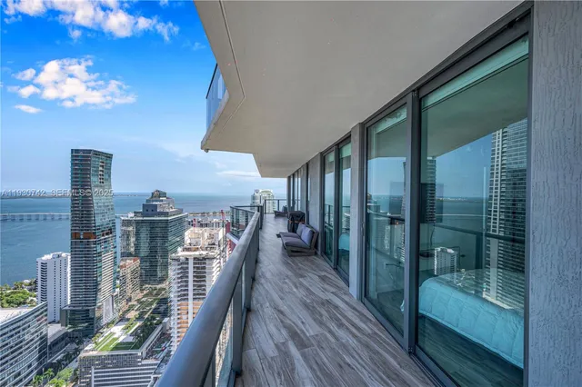 a view of balcony with furniture