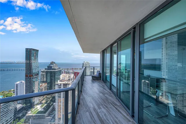 a view of a balcony with furniture