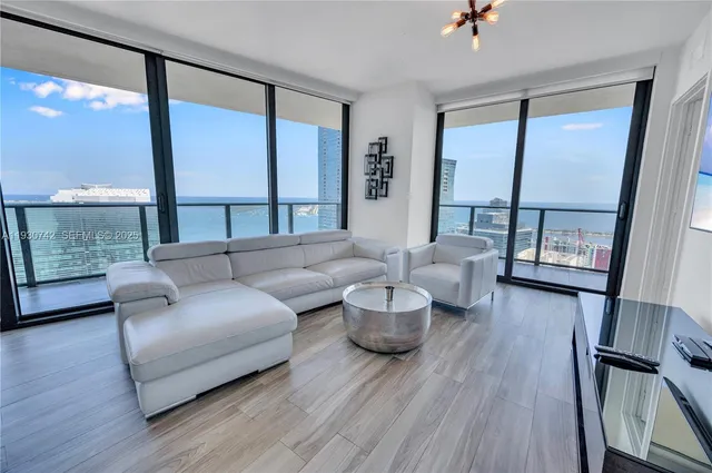 a living room with furniture and a large window