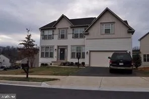 a car parked in front of a house