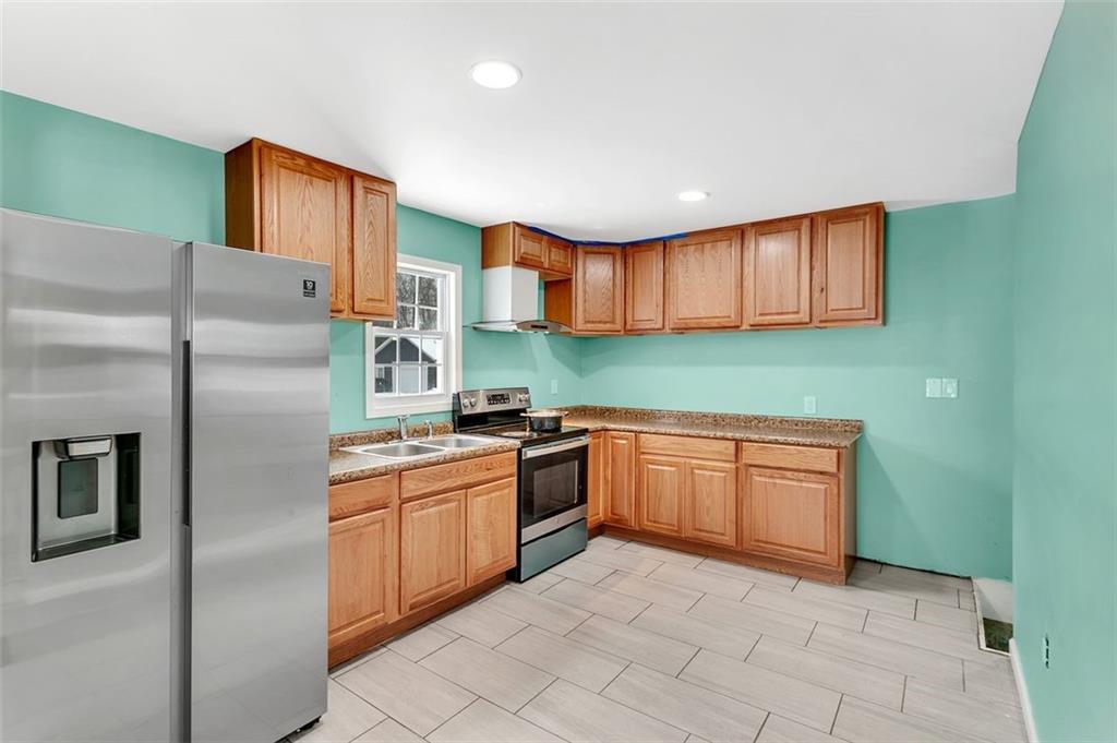 742 Jackson Road Apollo, PA 15613 - Photo 12 of 20 a kitchen with stainless steel appliances granite countertop a refrigerator sink and cabinets
