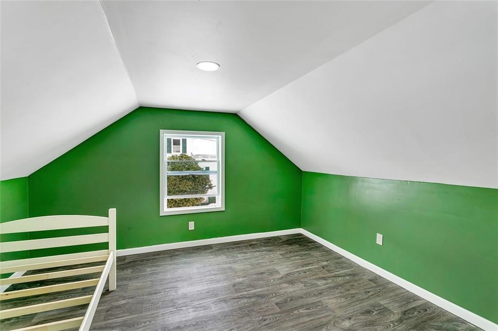 742 Jackson Road Apollo, PA 15613 - Photo 16 of 20 a view of an empty room with window and wooden floor