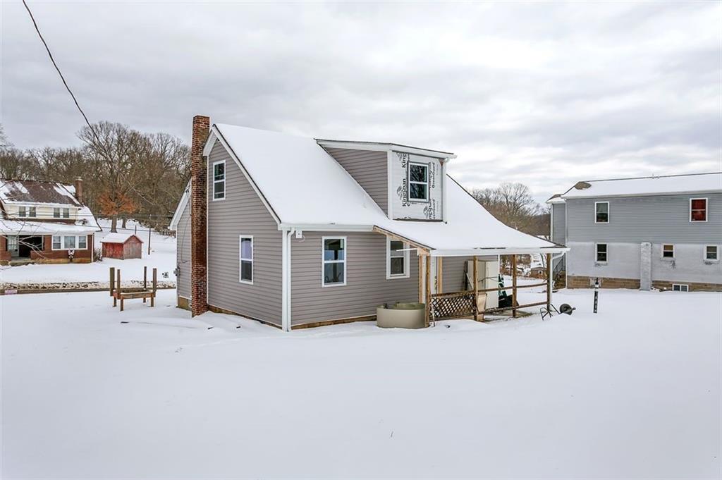 742 Jackson Road Apollo, PA 15613 - Photo 3 of 20 a view of a white house with a yard