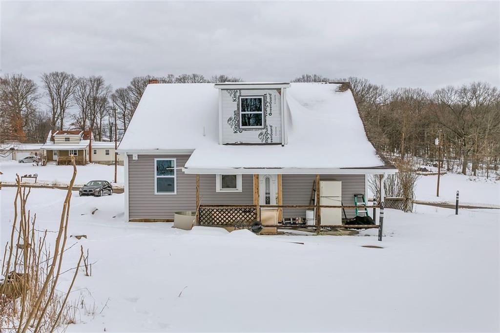 742 Jackson Road Apollo, PA 15613 - Photo 4 of 20 a view of a white house with a snow in the background