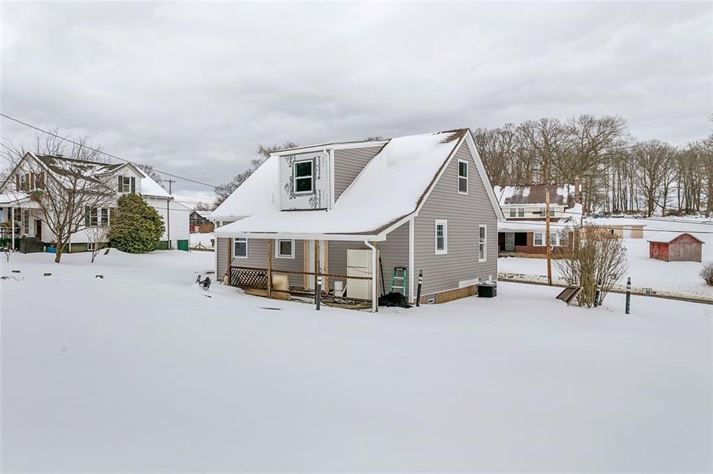 742 Jackson Road Apollo, PA 15613 - Photo 5 of 20 a view of a house with a snow in a yard
