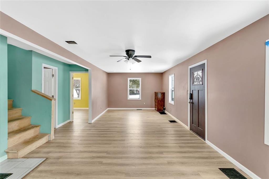 742 Jackson Road Apollo, PA 15613 - Photo 7 of 20 a view of a livingroom with wooden floor and a ceiling fan