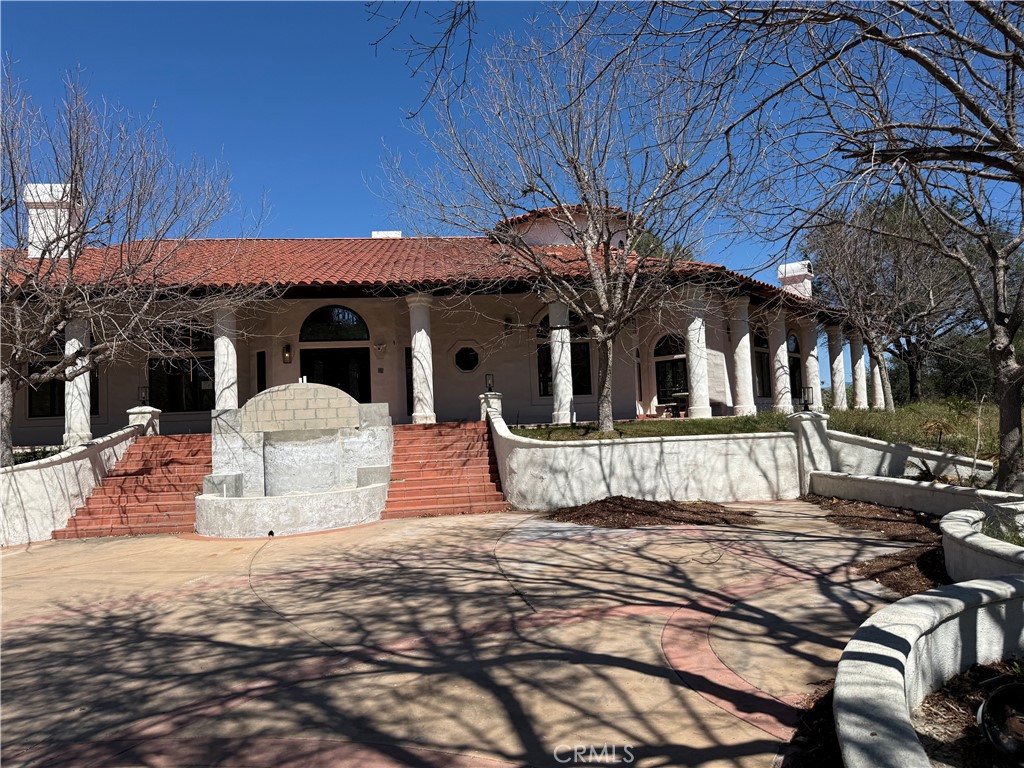 16515 Valley Ranch Road Canyon Country, CA 91387 - Photo 1 of 1 a view of a house with a yard