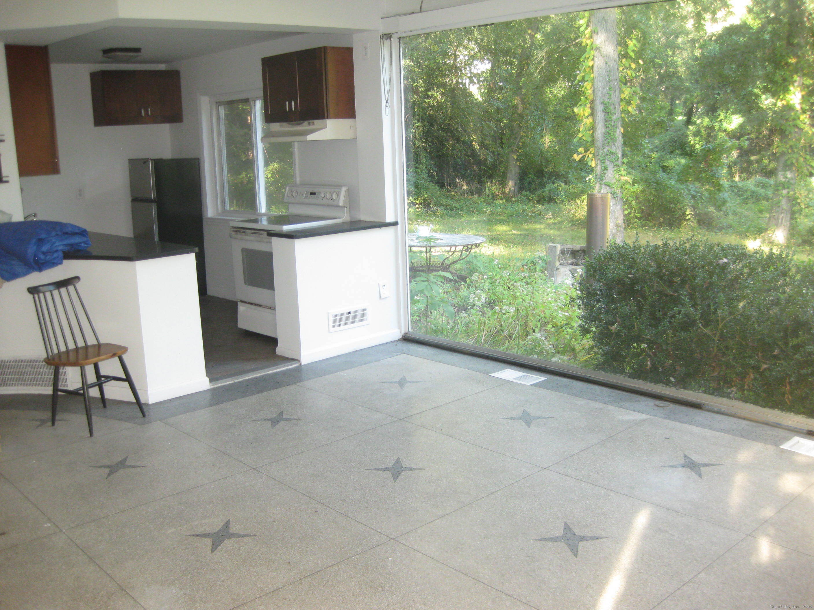 a view of backyard with tub and outdoor view
