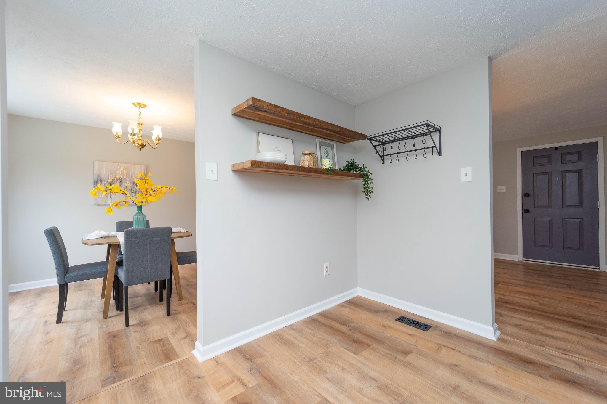 6922 Pinecrest Road Catonsville, MD 21228 - Photo 12 of 36 a view of dining room and wooden floor