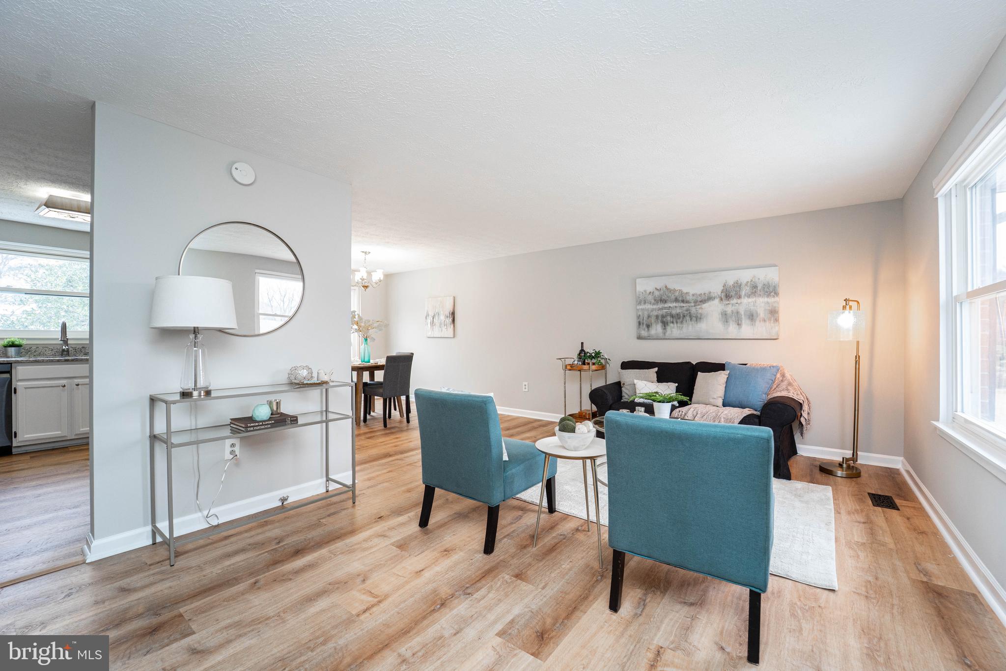 6922 Pinecrest Road Catonsville, MD 21228 - Photo 2 of 36 a view of a dining room with furniture and wooden floor