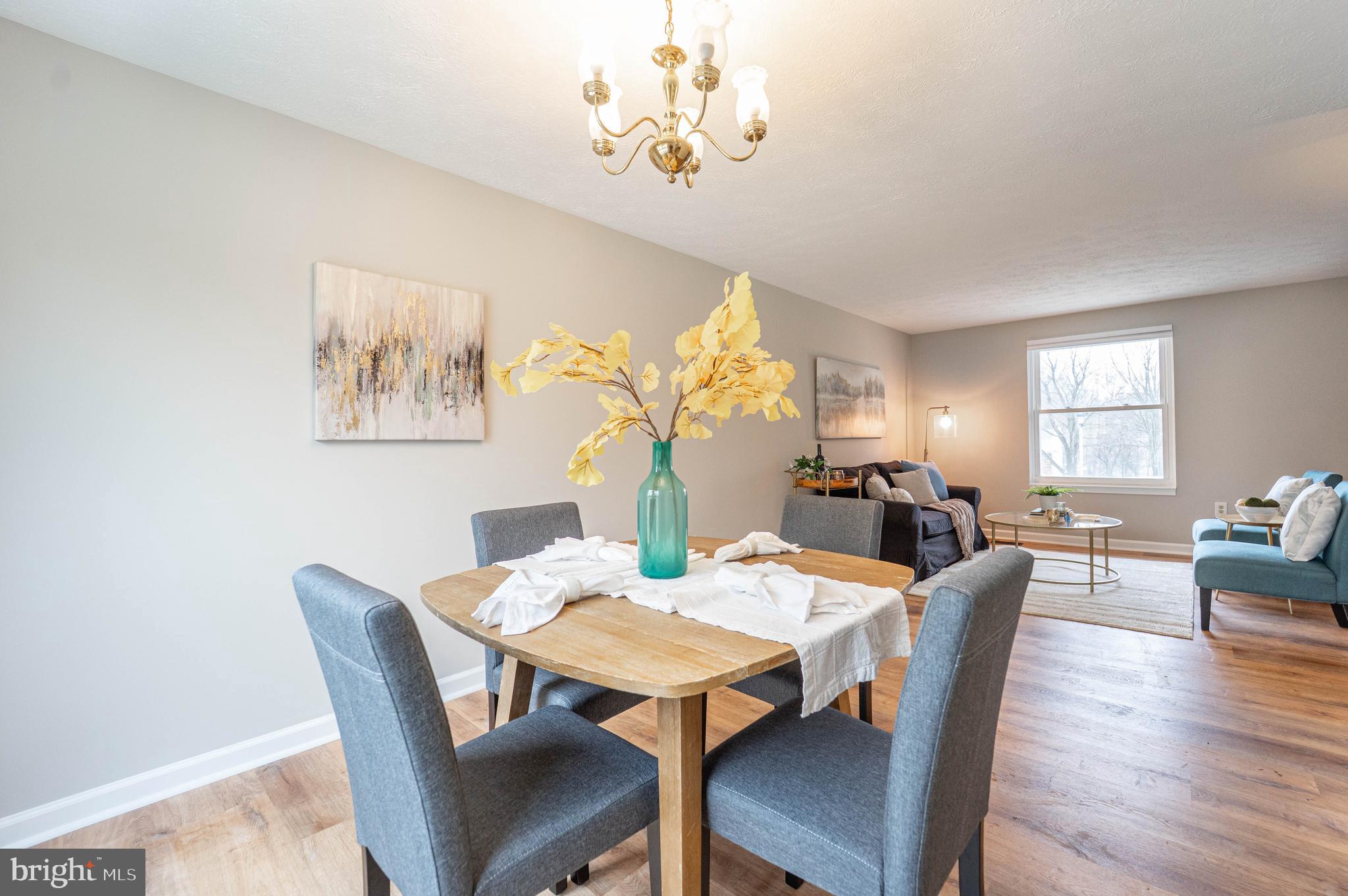 6922 Pinecrest Road Catonsville, MD 21228 - Photo 8 of 36 a view of a dining room with furniture window and wooden floor