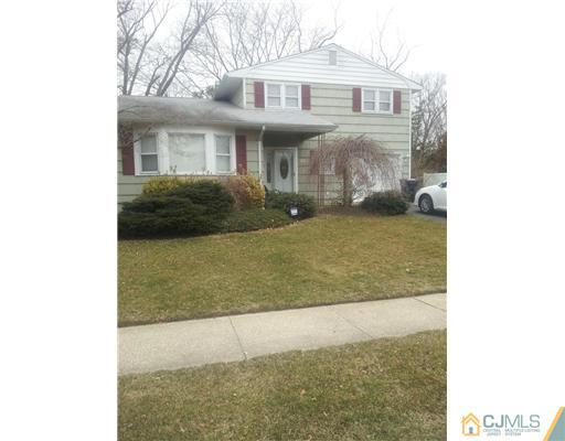 20 Dumas Road Old Bridge, NJ 08857 - Photo 1 of 1 a front view of a house with a yard