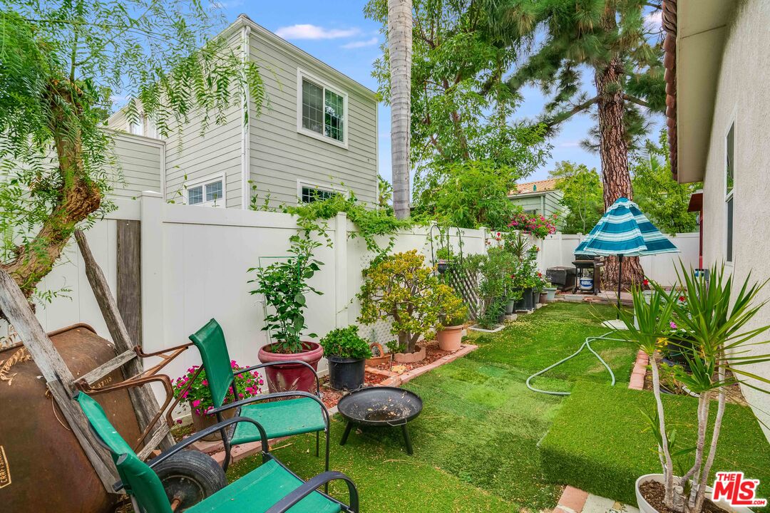 146 Apache Topanga, CA 90290 - Photo 11 of 21 a view of a chairs and table in backyard