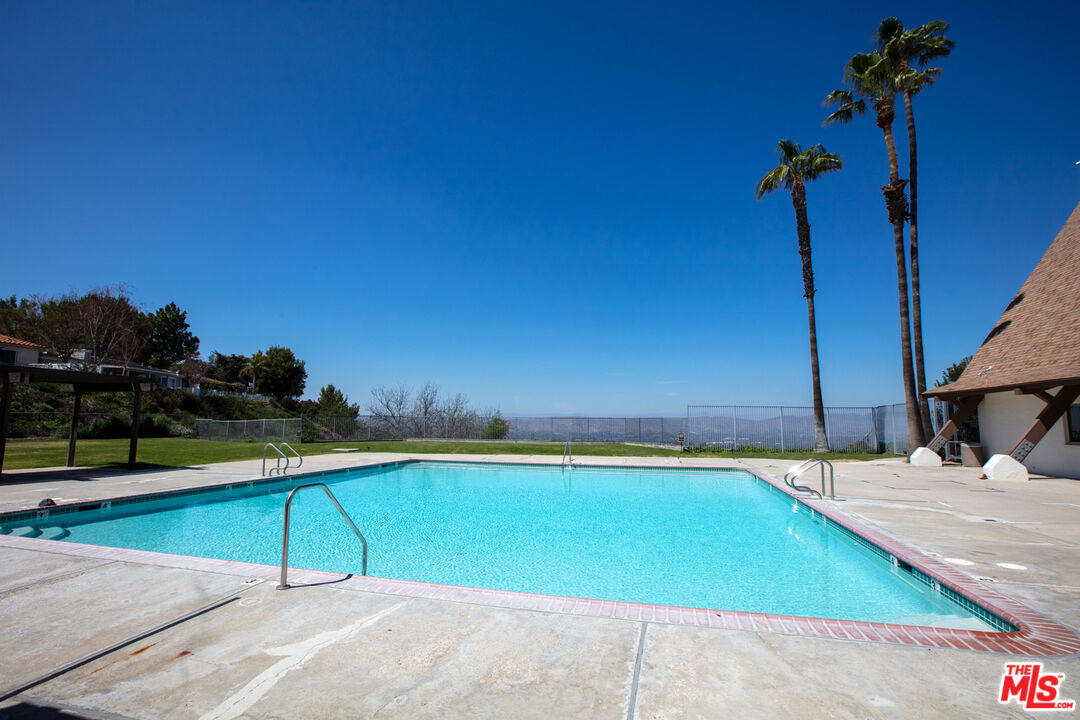 146 Apache Topanga, CA 90290 - Photo 17 of 21 a view of a swimming pool with a chair