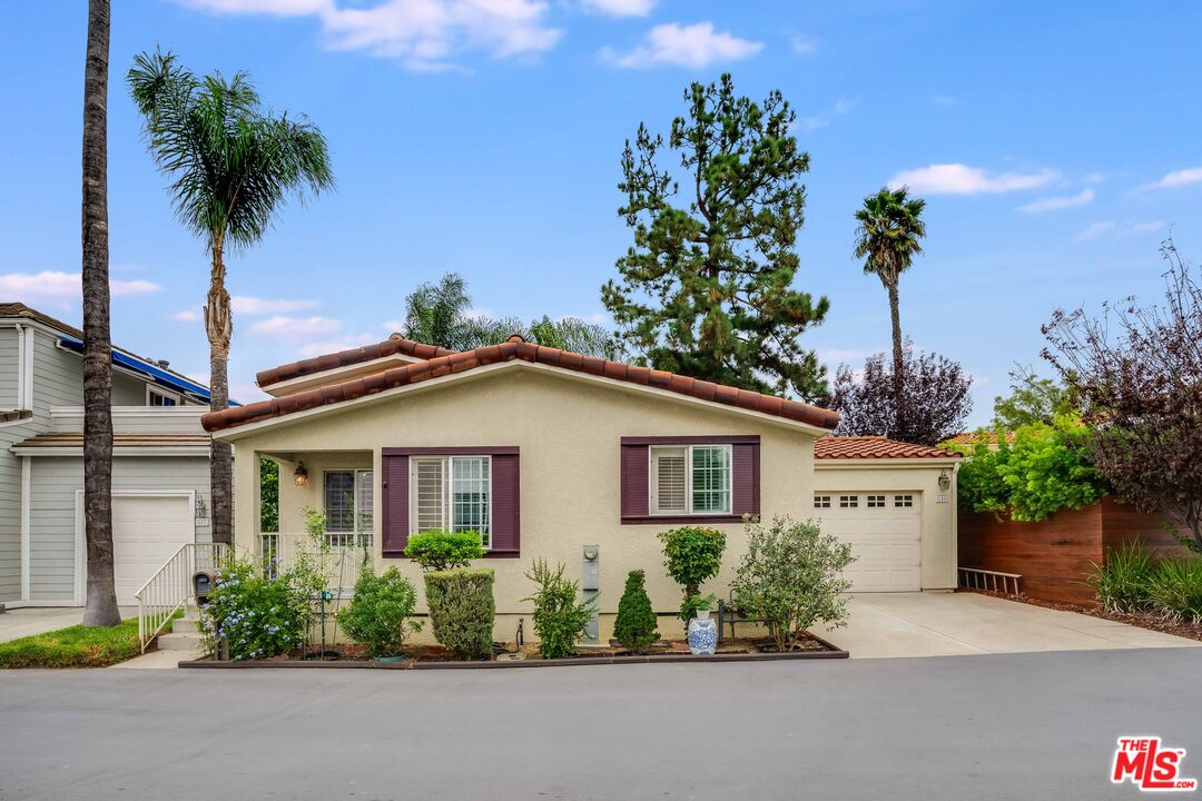 146 Apache Topanga, CA 90290 - Photo 2 of 21 a front view of a house with a garden