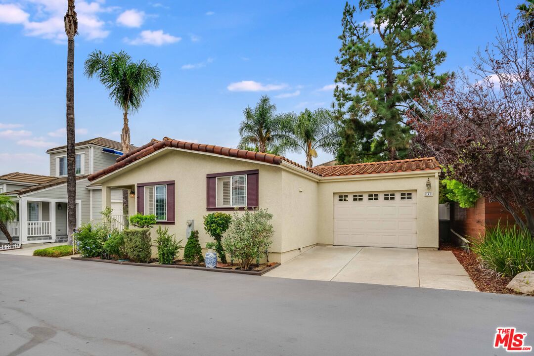 146 Apache Topanga, CA 90290 - Photo 21 of 21 a view of a house with a yard and palm trees