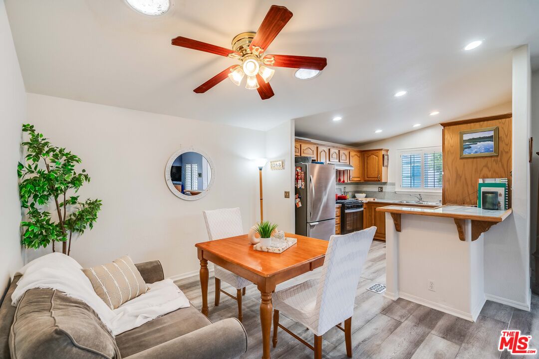 146 Apache Topanga, CA 90290 - Photo 5 of 21 a living room with furniture kitchen view and a potted plant