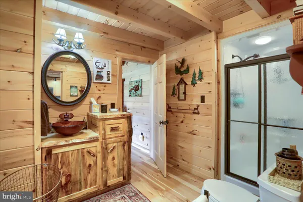 a bedroom with furniture and a flat screen tv