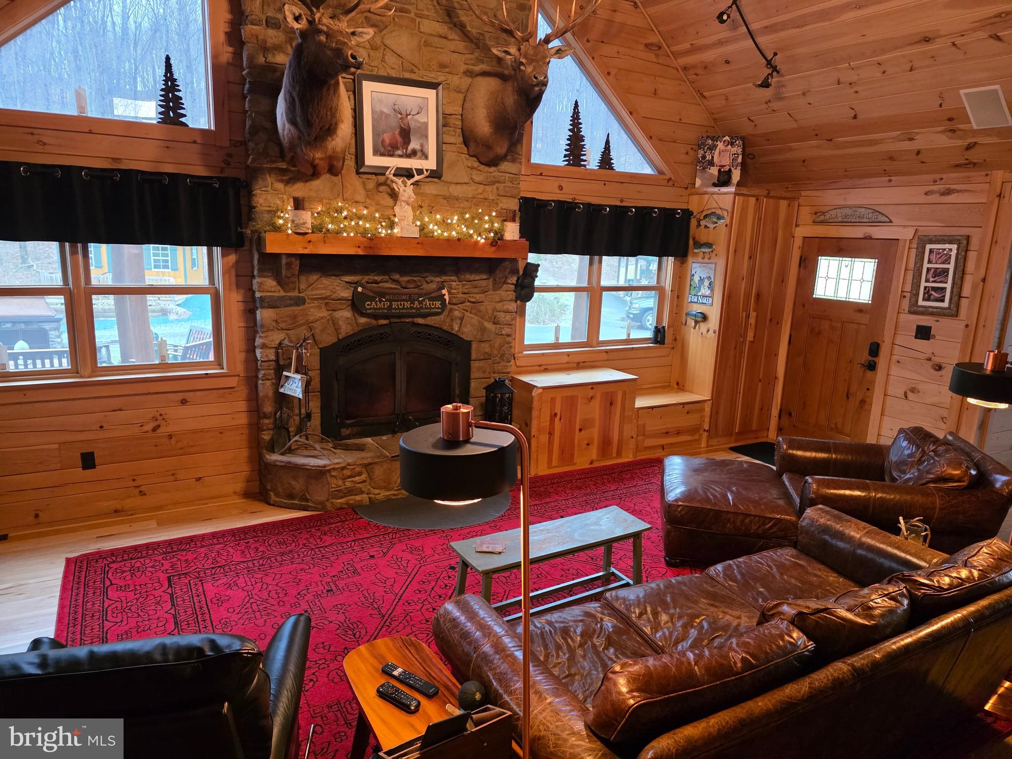 1560 Rhine Hollow Road East Waterford, PA 17021 - Photo 14 of 113 a living room with furniture a fireplace and a window