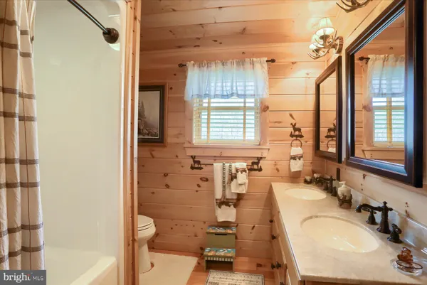 a front view of a house with yard and garage