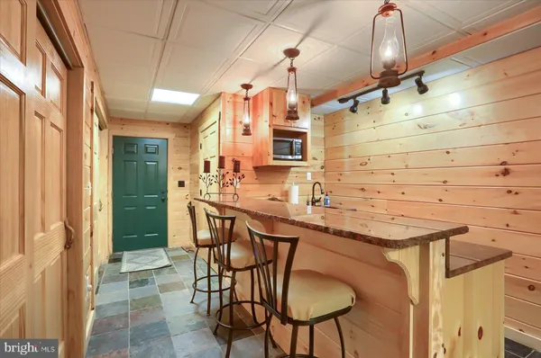 a en suite bathroom with a double vanity sink a mirror and shower