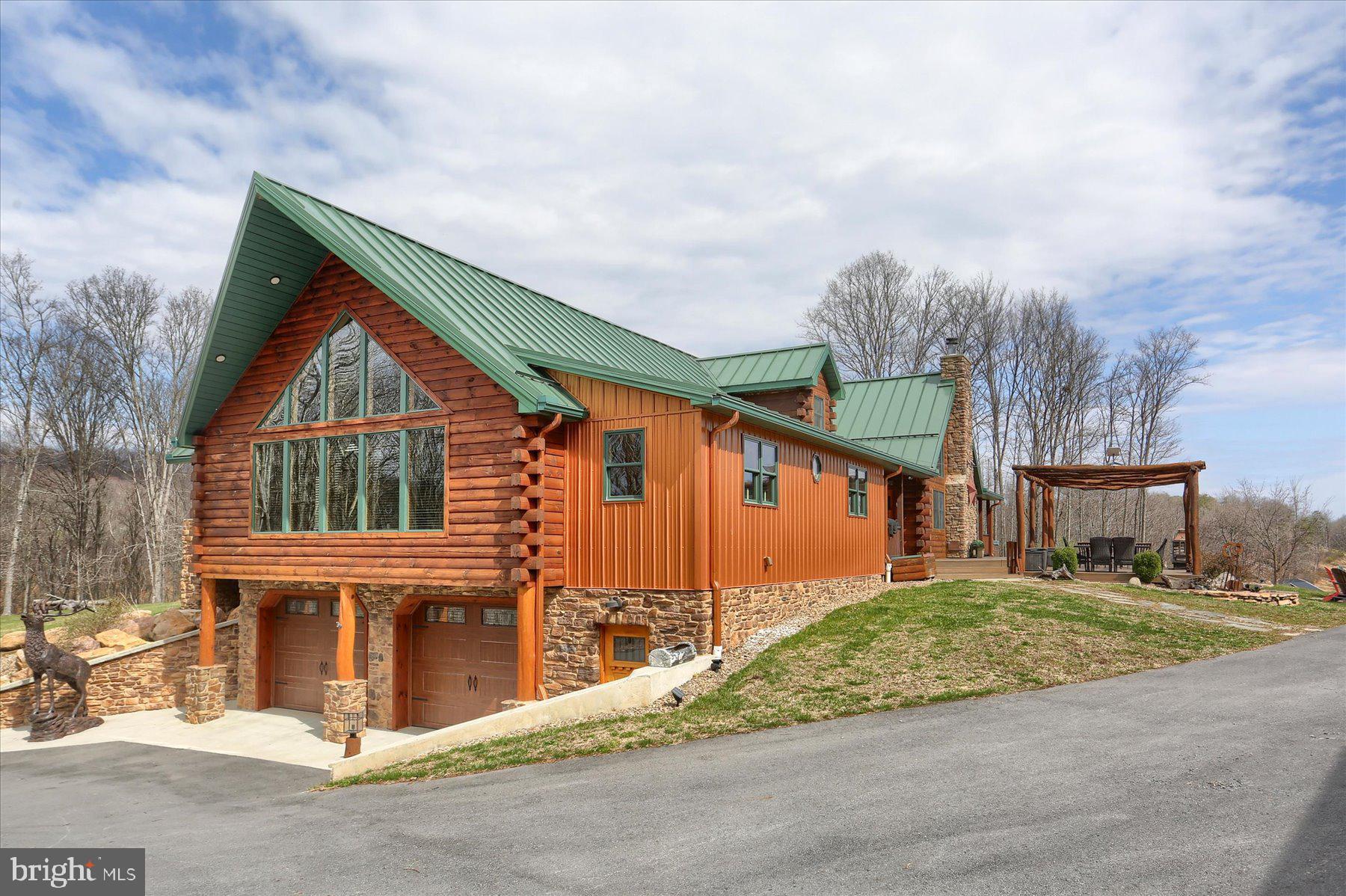 1560 Rhine Hollow Road East Waterford, PA 17021 - Photo 4 of 113 a front view of a house with a garden