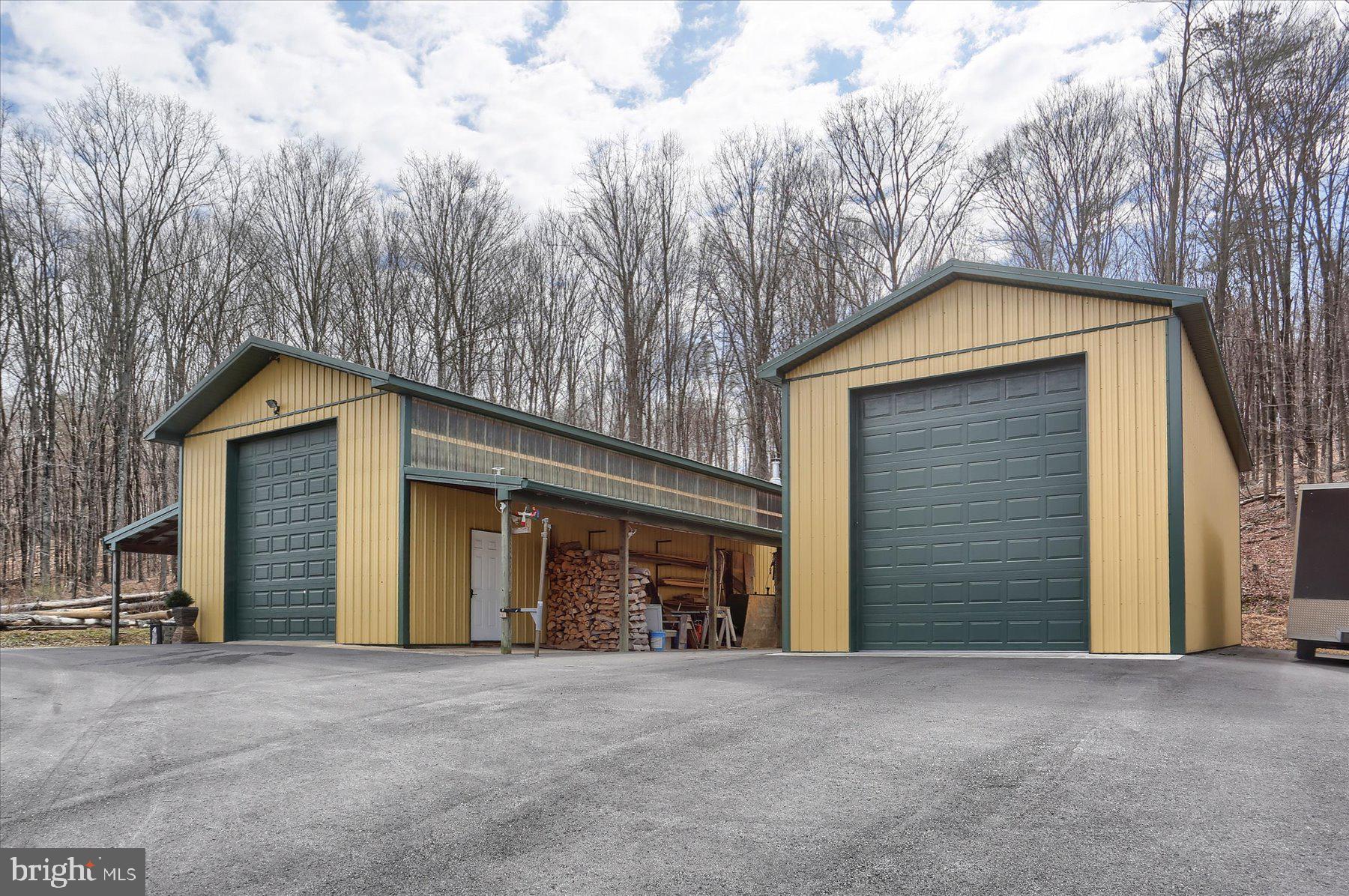 1560 Rhine Hollow Road East Waterford, PA 17021 - Photo 68 of 113 a front view of a house with yard and garage