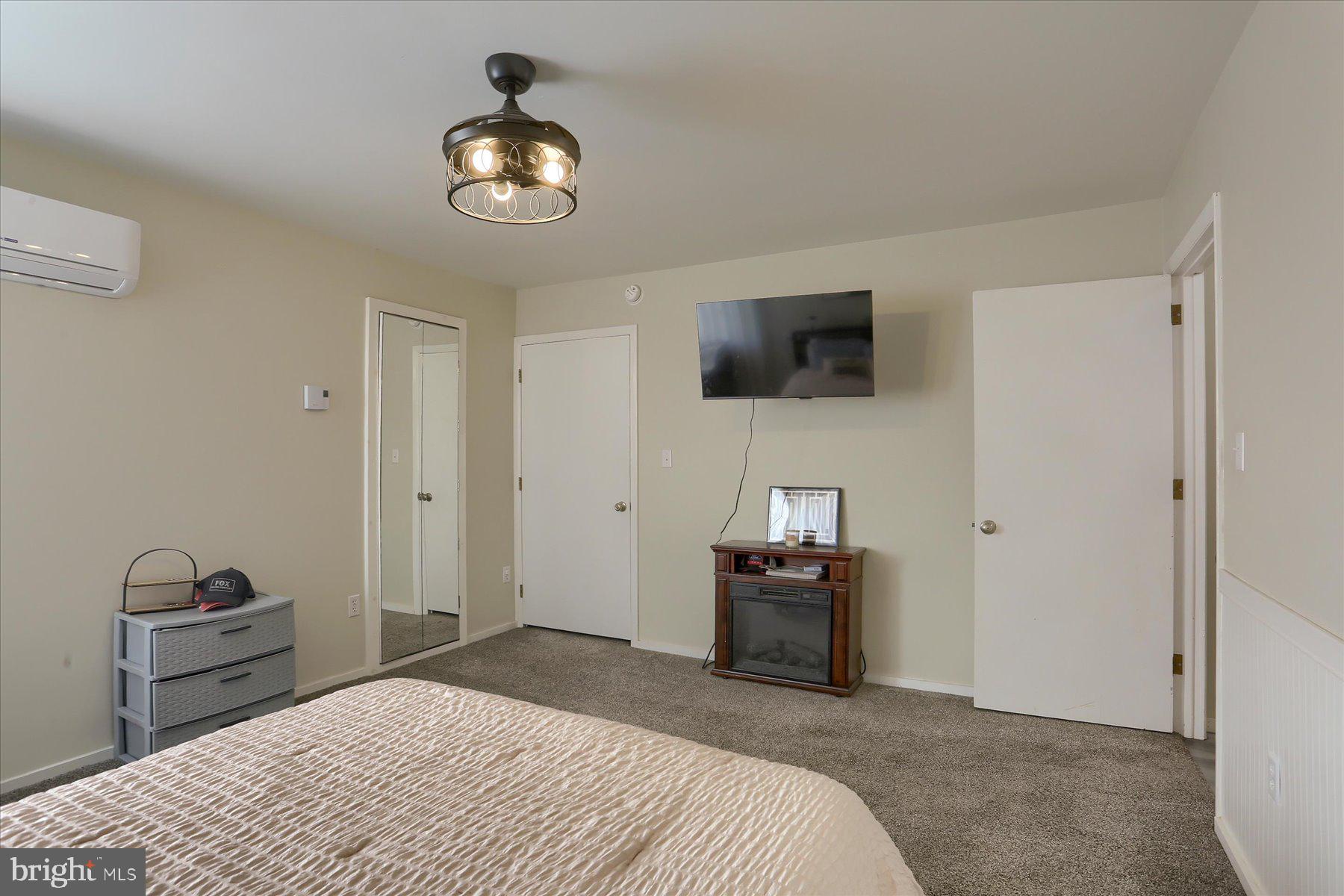 1560 Rhine Hollow Road East Waterford, PA 17021 - Photo 88 of 113 a bedroom with a bed and a flat screen tv