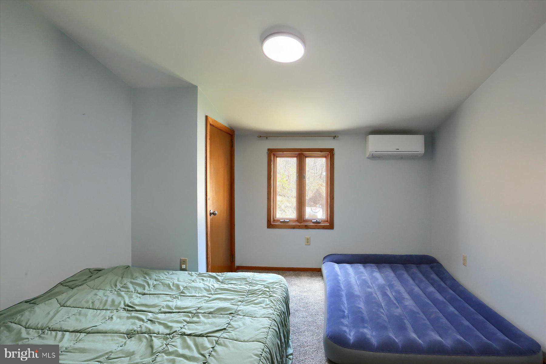 1560 Rhine Hollow Road East Waterford, PA 17021 - Photo 90 of 113 a bedroom with a bed and window