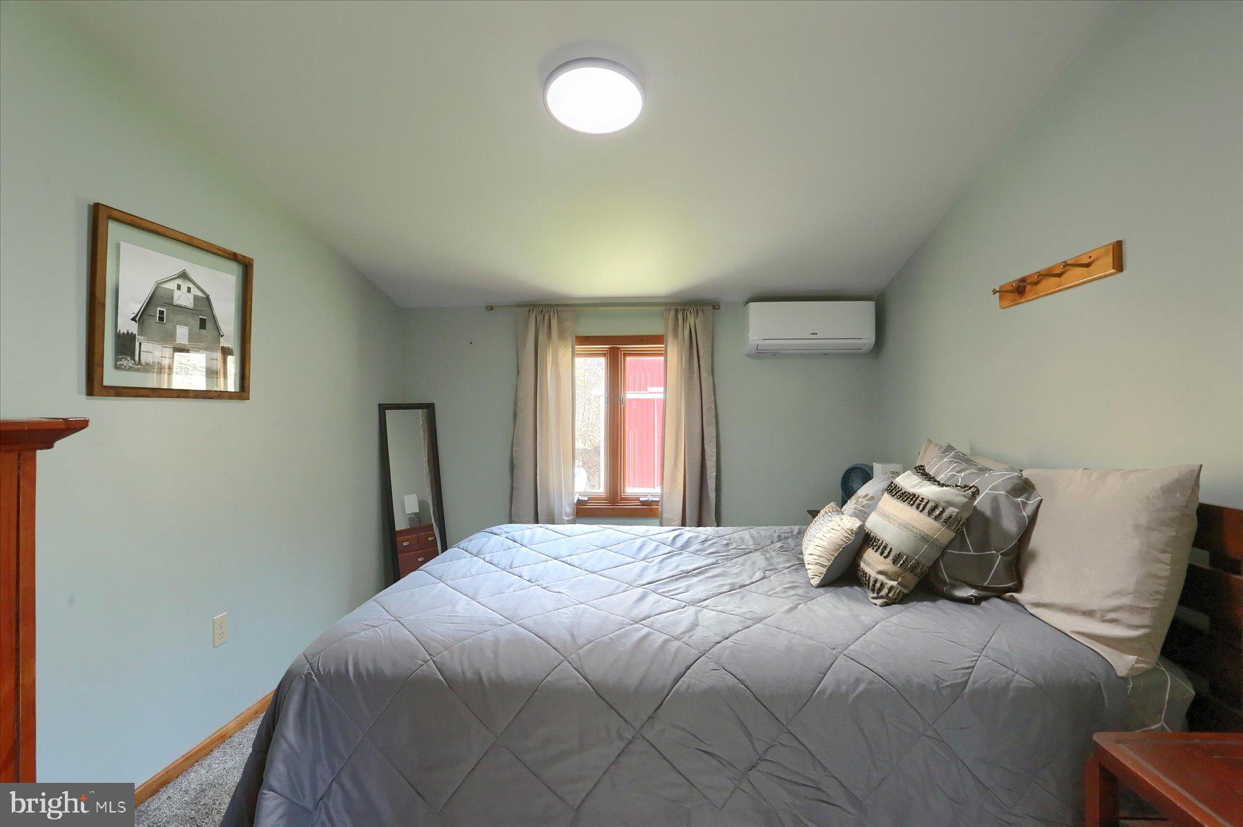 1560 Rhine Hollow Road East Waterford, PA 17021 - Photo 92 of 113 a bedroom with a bed and window