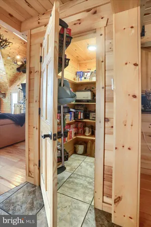a bedroom with furniture and a chandelier