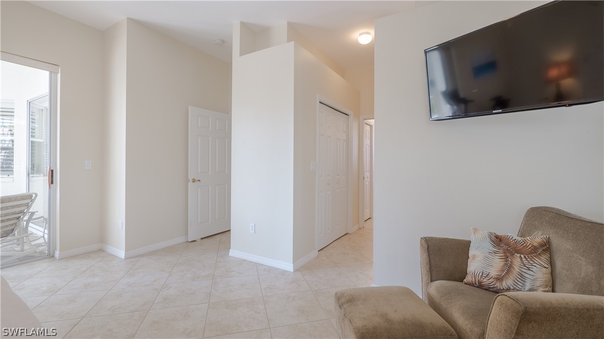 8734 Brittania Drive Fort Myers, FL 33912 - Photo 12 of 34 a living room with furniture and a flat screen tv