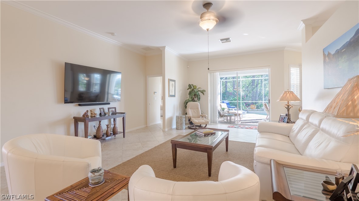 8734 Brittania Drive Fort Myers, FL 33912 - Photo 5 of 34 a living room with furniture and a flat screen tv