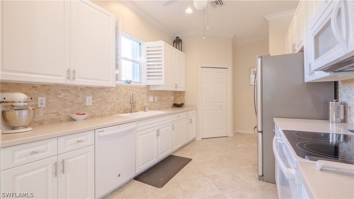 8734 Brittania Drive Fort Myers, FL 33912 - Photo 8 of 34 a bathroom with a sink and a bathtub
