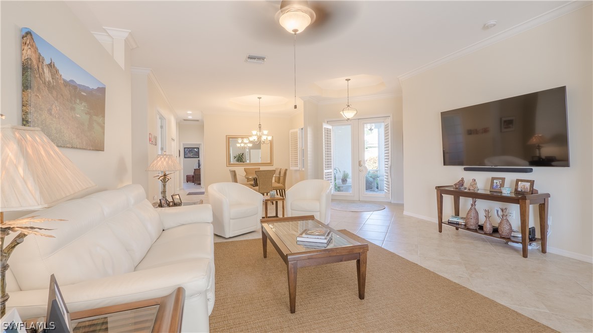 8734 Brittania Drive Fort Myers, FL 33912 - Photo 10 of 34 a living room with furniture and a flat screen tv
